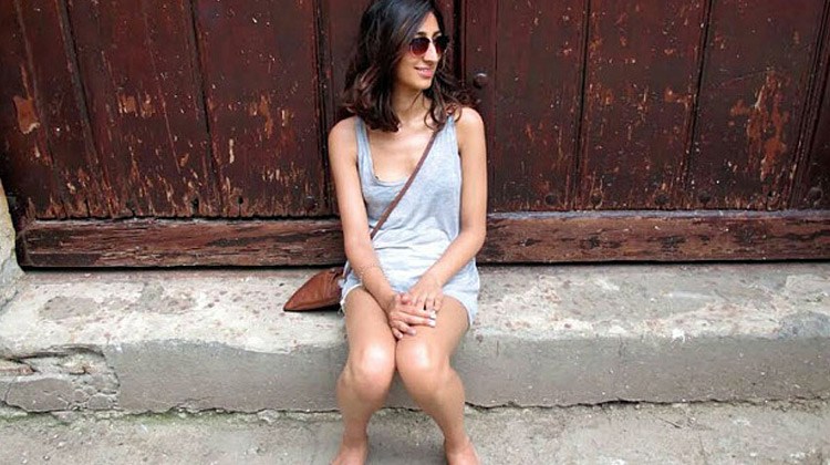 Cuban girl sitting on the street