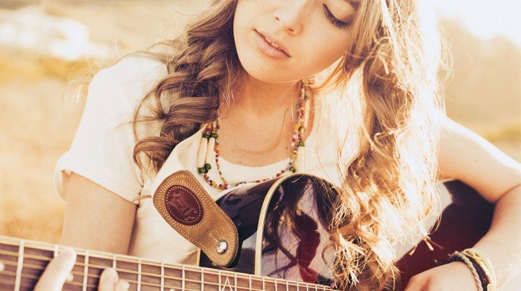 romantic girl playing her guitar