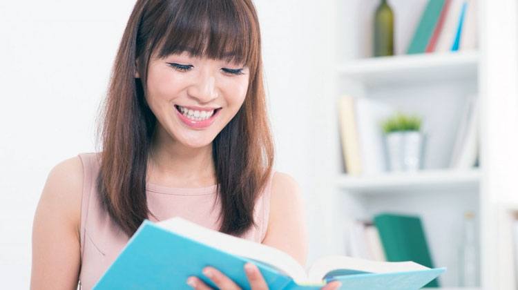 Chinese girl reading a book