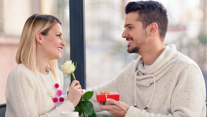 man-giving-flowers-and-gift-to-his-girl