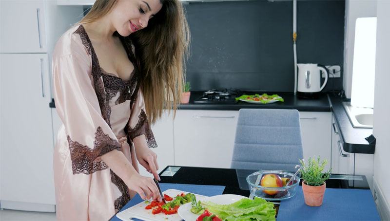 sexy Ukrainian girl preparing food