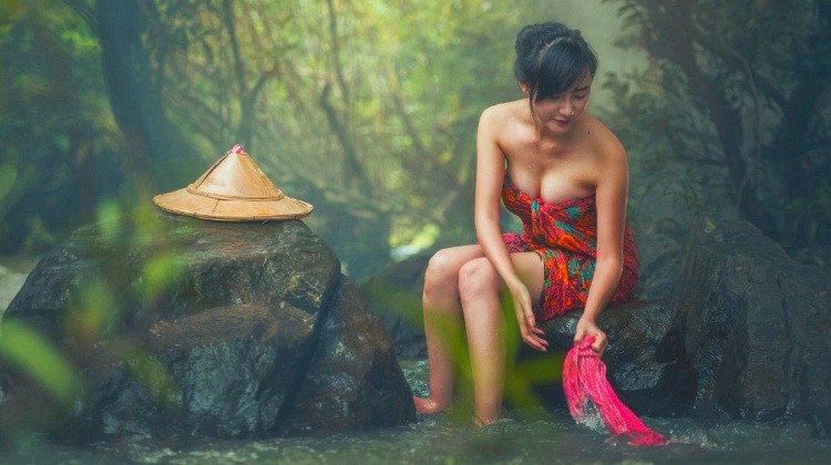 beautiful Vietnamese girl washing clothes