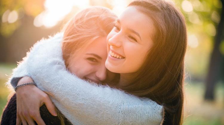 Czech woman hugging another girl