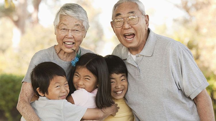 happy Asian grandparents with their grandkids