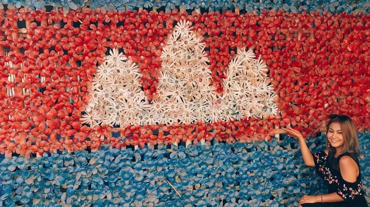 cambodian flag made out of plastic bottles and a gorgeous cambodian girl